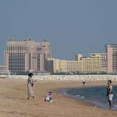 People visit the West Bay beach in Doha on November 19, 2022, ahead of the Qatar 2022 World Cup.