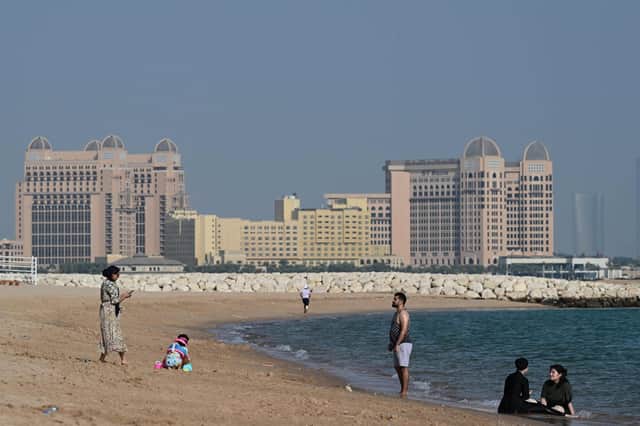 People visit the West Bay beach in Doha on November 19, 2022, ahead of the Qatar 2022 World Cup.