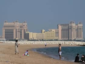People visit the West Bay beach in Doha on November 19, 2022, ahead of the Qatar 2022 World Cup.