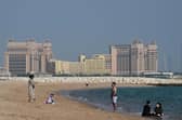 People visit the West Bay beach in Doha on November 19, 2022, ahead of the Qatar 2022 World Cup.