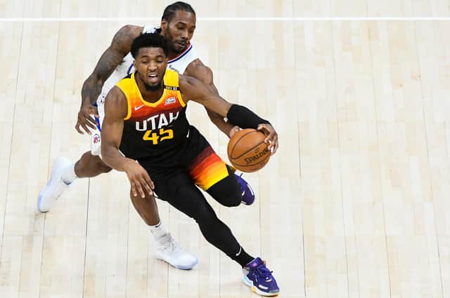 In-form talisman Donovan Mitchell of the Utah Jazz drives in front of LA Clippers' Kawhi Leonard in a closely-fought Western Conference play-off series. Picture: Alex Goodlett/Getty