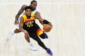In-form talisman Donovan Mitchell of the Utah Jazz drives in front of LA Clippers' Kawhi Leonard in a closely-fought Western Conference play-off series. Picture: Alex Goodlett/Getty