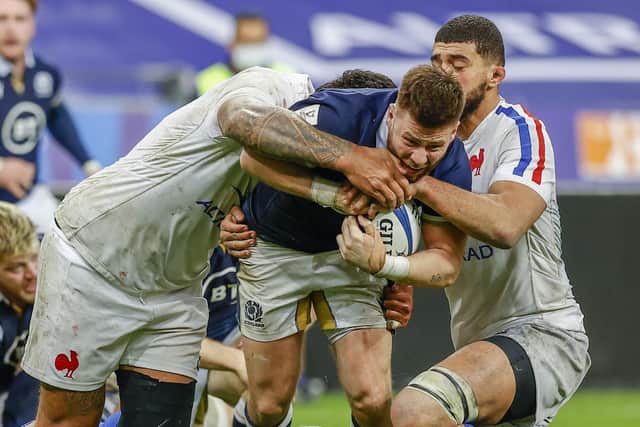 Scotland's Ali Price is tackeld by Swan Rebbadj during a Guinness Six Nations match between France and Scotland at the Stade de France, on March 26, 2021, in Paris, France.