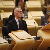 Scotland's Deputy First Minister and temporary Cabinet Secretary for Finance and Economy, John Swinney MSP, sat next to First Minister of Scotland Nicola Sturgeon, as he delivers the Scottish Budget to the Scottish Parliament in Edinburgh.