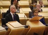 Scotland's Deputy First Minister and temporary Cabinet Secretary for Finance and Economy, John Swinney MSP, sat next to First Minister of Scotland Nicola Sturgeon, as he delivers the Scottish Budget to the Scottish Parliament in Edinburgh.