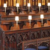 The Queen pictured sitting alone in St George's Chapel at Prince Philip's funeral