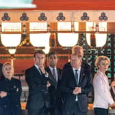 (Left to right) European Council president Charles Michel, Canada's Prime Minister Justin Trudeau, Italy's Prime Minister Giorgia Meloni, Britain's Prime Minister Rishi Sunak, France's president Emmanuel Macron, German Chancellor Olaf Scholz, US president Joe Biden and European Commission president Ursula von der Leyen are given a tour of the Itsukushima Shrine. Picture: Jacques Witt/POOL/AFP via Getty Images