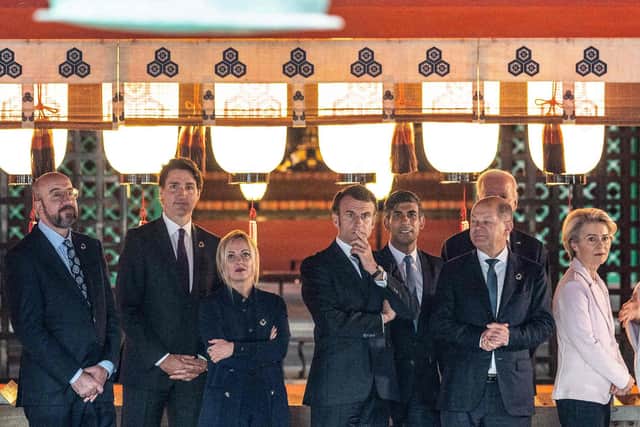 (Left to right) European Council president Charles Michel, Canada's Prime Minister Justin Trudeau, Italy's Prime Minister Giorgia Meloni, Britain's Prime Minister Rishi Sunak, France's president Emmanuel Macron, German Chancellor Olaf Scholz, US president Joe Biden and European Commission president Ursula von der Leyen are given a tour of the Itsukushima Shrine. Picture: Jacques Witt/POOL/AFP via Getty Images