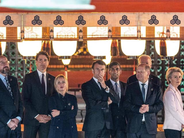 (Left to right) European Council president Charles Michel, Canada's Prime Minister Justin Trudeau, Italy's Prime Minister Giorgia Meloni, Britain's Prime Minister Rishi Sunak, France's president Emmanuel Macron, German Chancellor Olaf Scholz, US president Joe Biden and European Commission president Ursula von der Leyen are given a tour of the Itsukushima Shrine. Picture: Jacques Witt/POOL/AFP via Getty Images