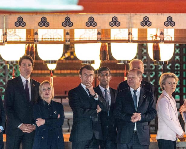 (Left to right) European Council president Charles Michel, Canada's Prime Minister Justin Trudeau, Italy's Prime Minister Giorgia Meloni, Britain's Prime Minister Rishi Sunak, France's president Emmanuel Macron, German Chancellor Olaf Scholz, US president Joe Biden and European Commission president Ursula von der Leyen are given a tour of the Itsukushima Shrine. Picture: Jacques Witt/POOL/AFP via Getty Images