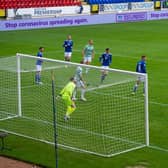 Leigh Griffiths heads home the opening goal in the 90th minute. Picture: SNS