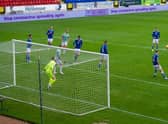 Leigh Griffiths heads home the opening goal in the 90th minute. Picture: SNS