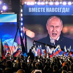 Russian President Vladimir Putin is seen on a giant screen at Red Square as he addresses a rally in 2022 (Picture: Alexander NEMENOV/AFP)