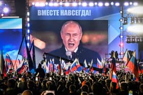 Russian President Vladimir Putin is seen on a giant screen at Red Square as he addresses a rally in 2022 (Picture: Alexander NEMENOV/AFP)