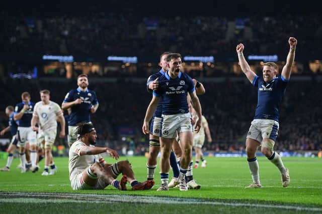 Scotland's Ben White celebrates with team-mates after scoring his try against England.