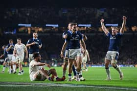 Scotland's Ben White celebrates with team-mates after scoring his try against England.