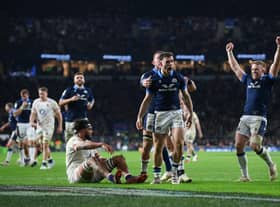 Scotland's Ben White celebrates with team-mates after scoring his try against England.