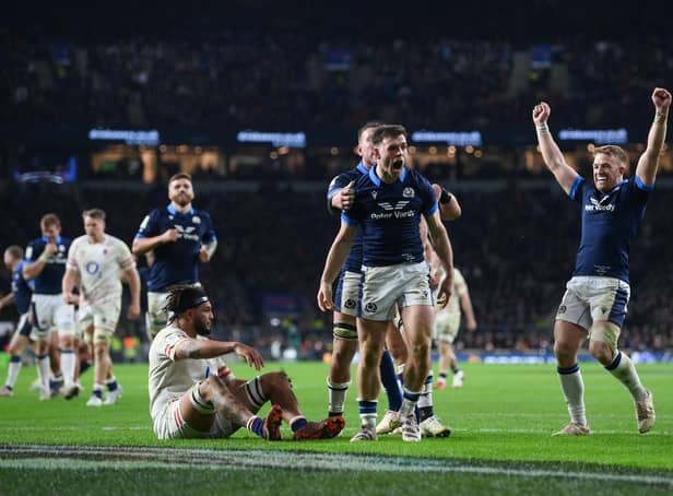 Scotland's Ben White celebrates with team-mates after scoring his try against England.