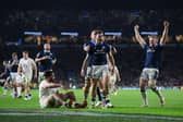 Scotland's Ben White celebrates with team-mates after scoring his try against England.