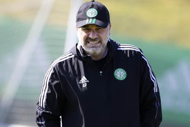 Ange Postecoglou dons a cap to shield him from the sunshine at Celtic's Friday training session but doesn't feel his team need protected from the title race tensions being projected on to them. (Photo by Alan Harvey / SNS Group)