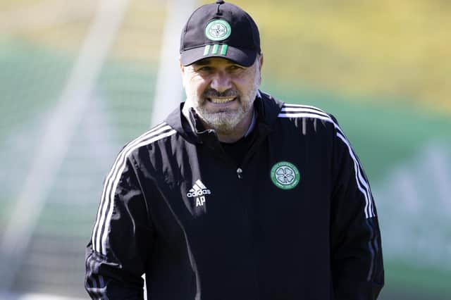 Ange Postecoglou dons a cap to shield him from the sunshine at Celtic's Friday training session but doesn't feel his team need protected from the title race tensions being projected on to them. (Photo by Alan Harvey / SNS Group)