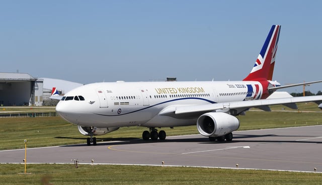 The RAF Voyager used by the Prime Minister and the royal family on the runway at Cambridge airport where it has been repainted in the colours of the Union flag at a cost of almost £1 million. Picture: PA