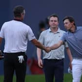 Bob MacIntyre looks on as Justin Rose and Matt Fitzpatrick shake hands on the 18th green at Wentworth. Picture: Richard Heathcote/Getty Images.
