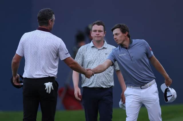 Bob MacIntyre looks on as Justin Rose and Matt Fitzpatrick shake hands on the 18th green at Wentworth. Picture: Richard Heathcote/Getty Images.