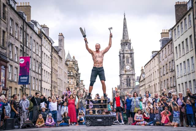 Circus street artist 'Reidiculous' performs for the crowds on the Royal Mile ahead of the official launch of the Fringe on Friday. Picture: Jane Barlow/PA Wire