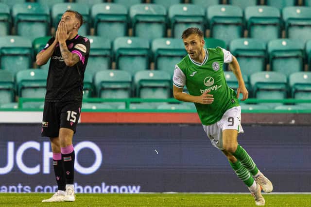 Dylan Vente (R) celebrates after scoring Hibs' second to leave St Mirren's Caolan Boyd-Munce dejected. (Photo by Mark Scates / SNS Group)