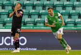 Dylan Vente (R) celebrates after scoring Hibs' second to leave St Mirren's Caolan Boyd-Munce dejected. (Photo by Mark Scates / SNS Group)