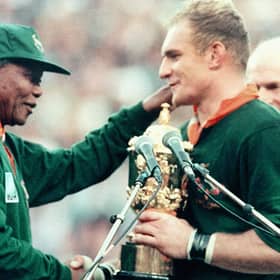 South African President Nelson Mandela congratulates the national rugby team captain François Pienaar after victory in the 1995 World Cup final (Picture: Jean-Pierre Muller/AFP via Getty Images)