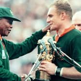 South African President Nelson Mandela congratulates the national rugby team captain François Pienaar after victory in the 1995 World Cup final (Picture: Jean-Pierre Muller/AFP via Getty Images)