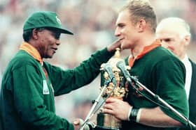 South African President Nelson Mandela congratulates the national rugby team captain François Pienaar after victory in the 1995 World Cup final (Picture: Jean-Pierre Muller/AFP via Getty Images)