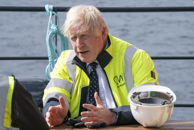Prime Minister Boris Johnson meets members of the crew onboard the Esvagt Alba during a visit to the Moray Offshore Windfarm East, off the Aberdeenshire coast, during his visit to Scotland.