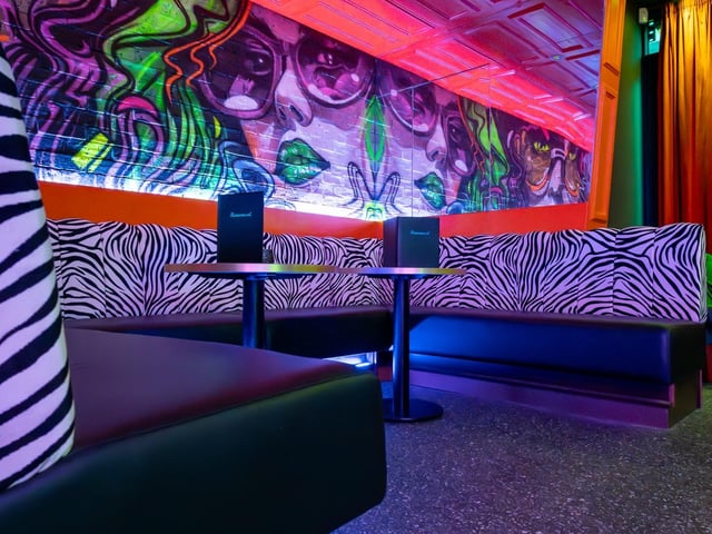 Back in the bar there's animal print seats and neon galore