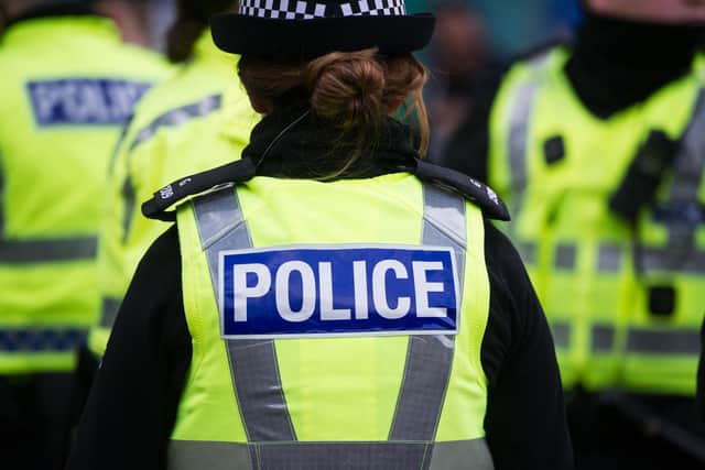 A woman posing as a police officer contacted residents from a withheld number.