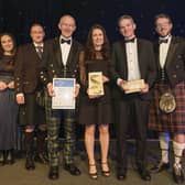 Collecting the award: Dr Lorraine Hawkins, River Director (centre) On her left is Chair of the River Dee Trust - Sandy Bremner and on her is Edwin Third, River Operations Manager (Pic: Mike Wilkinson)