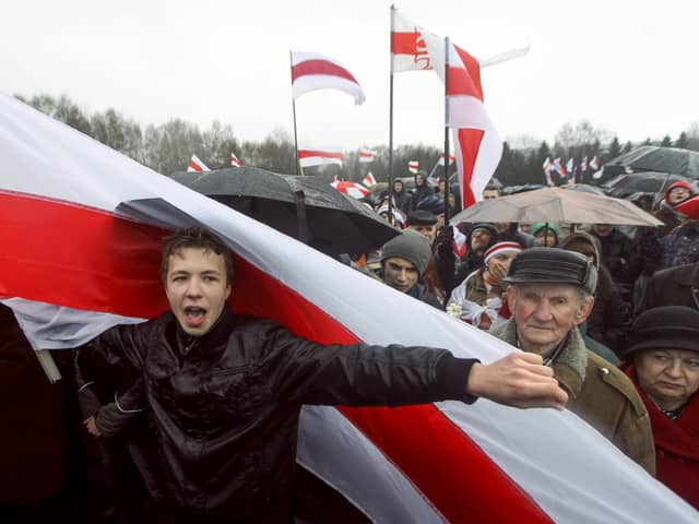 Raman Pratasevich, a prominent opponent of Belarus's authoritarian president , attends an opposition rally in Minsk in 2012 (Picture: AP)