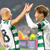GLASGOW, SCOTLAND - OCTOBER 25: Celtic's Kyogo Furuhashi celebrates with Daizen Maeda after making it 1-0 during a UEFA Champions League match between Celtic and Atletico de Madrid at Celtic Park, on October 25, 2023, in Glasgow, Scotland. (Photo by Rob Casey / SNS Group)