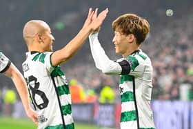GLASGOW, SCOTLAND - OCTOBER 25: Celtic's Kyogo Furuhashi celebrates with Daizen Maeda after making it 1-0 during a UEFA Champions League match between Celtic and Atletico de Madrid at Celtic Park, on October 25, 2023, in Glasgow, Scotland. (Photo by Rob Casey / SNS Group)