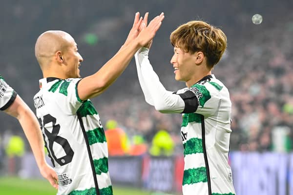 GLASGOW, SCOTLAND - OCTOBER 25: Celtic's Kyogo Furuhashi celebrates with Daizen Maeda after making it 1-0 during a UEFA Champions League match between Celtic and Atletico de Madrid at Celtic Park, on October 25, 2023, in Glasgow, Scotland. (Photo by Rob Casey / SNS Group)
