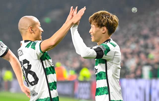 GLASGOW, SCOTLAND - OCTOBER 25: Celtic's Kyogo Furuhashi celebrates with Daizen Maeda after making it 1-0 during a UEFA Champions League match between Celtic and Atletico de Madrid at Celtic Park, on October 25, 2023, in Glasgow, Scotland. (Photo by Rob Casey / SNS Group)