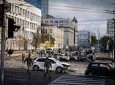 Emergency service personnel attend to the site of a blast in Kyiv.
