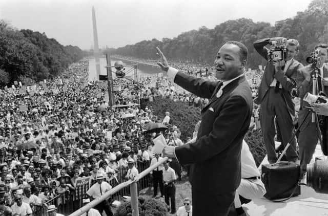 Martin Luther King waves to supporters on the Mall in Washington DC (Photo: -/AFP via Getty Images)