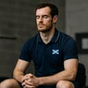 An athlete engages in mental training and psychological preparation, representing the growing sports psychology sector where Swiss firms like MentalMed expand internationally while Scotland strengthens its established mental performance coaching infrastructure through sportscotland and specialized practitioners.