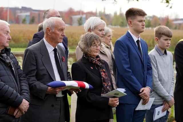 Family members of Robert Cook attend the service