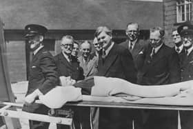 Minister of Health Aneurin Bevan watches a demonstration of a new stretcher on the first day of the new National Health Service in 1948 (Picture: Keystone/Hulton Archive/Getty Images)