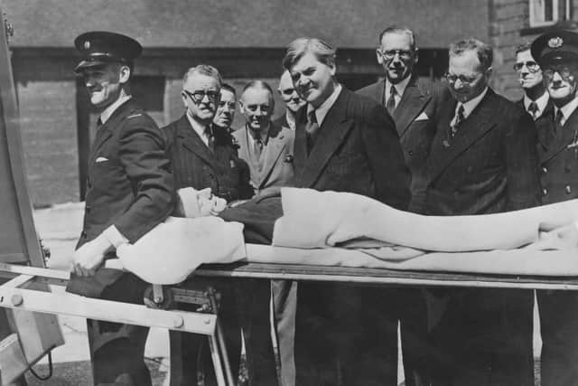 Minister of Health Aneurin Bevan watches a demonstration of a new stretcher on the first day of the new National Health Service in 1948 (Picture: Keystone/Hulton Archive/Getty Images)