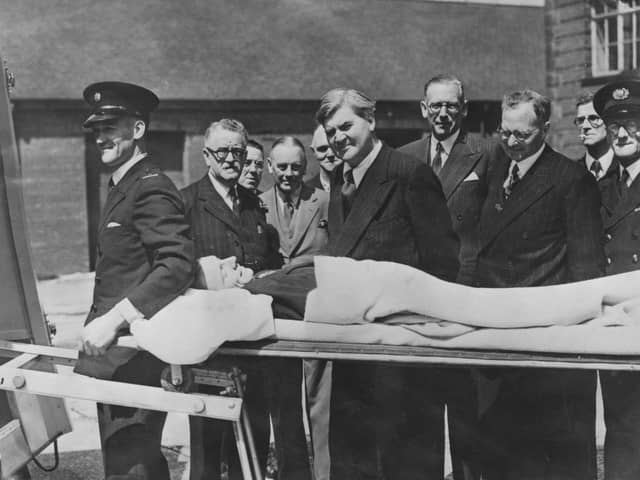 Minister of Health Aneurin Bevan watches a demonstration of a new stretcher on the first day of the new National Health Service in 1948 (Picture: Keystone/Hulton Archive/Getty Images)